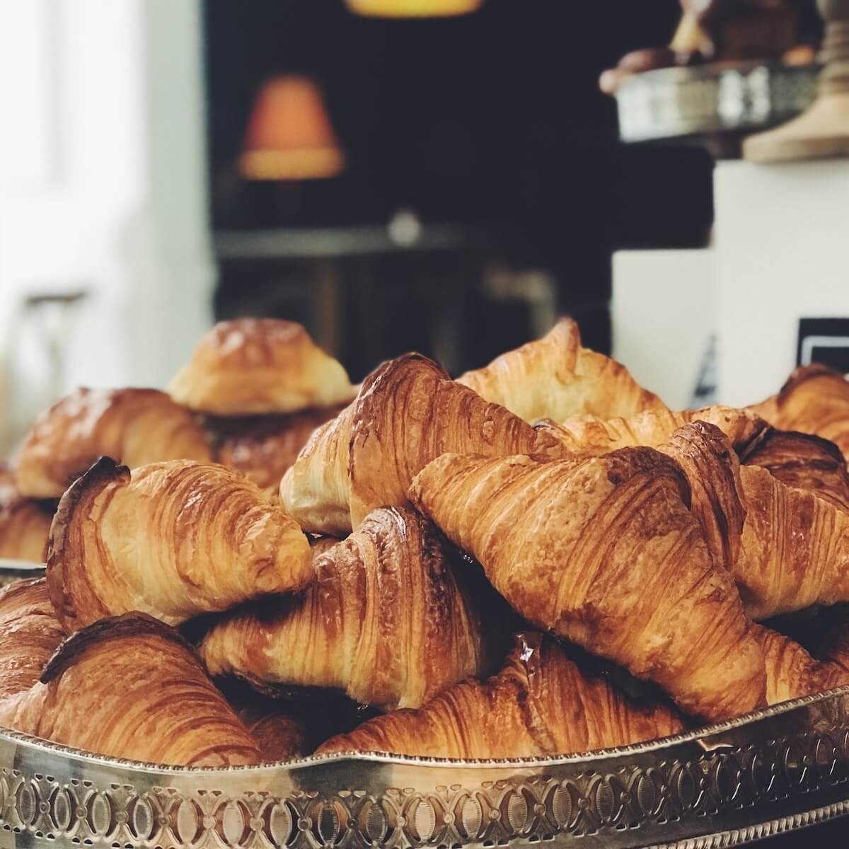 croissants stacked on a tray